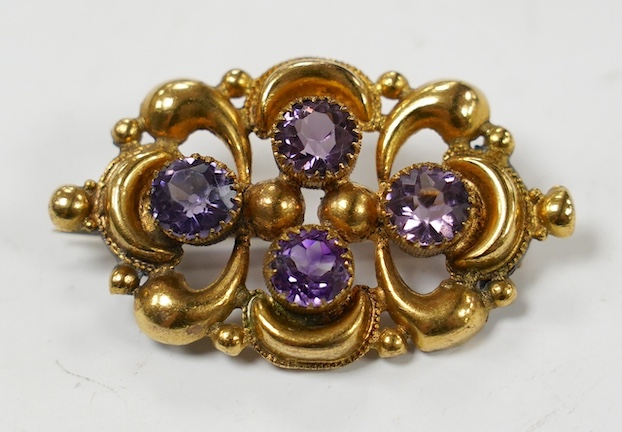 An early 20th century gilt metal and amethyst paste cluster set brooch, 44mm. Condition -poor.